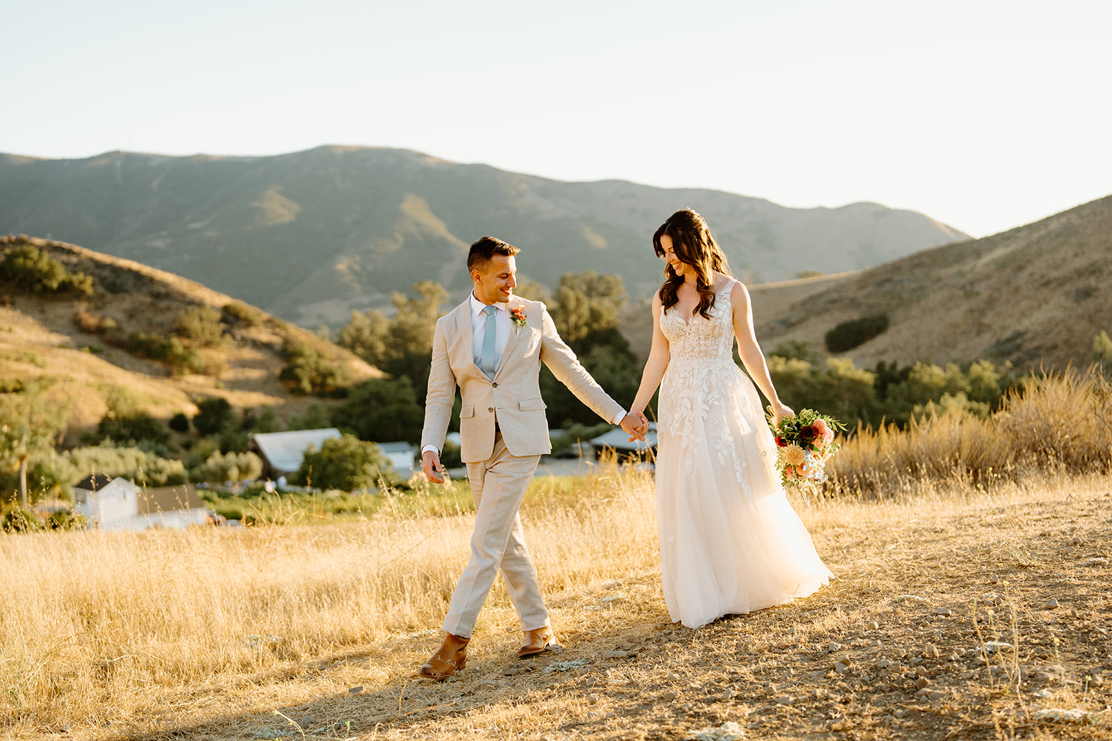bride and groom walk together at Higuera Ranch, San Luis Obispo CA, photography by Cobblestone