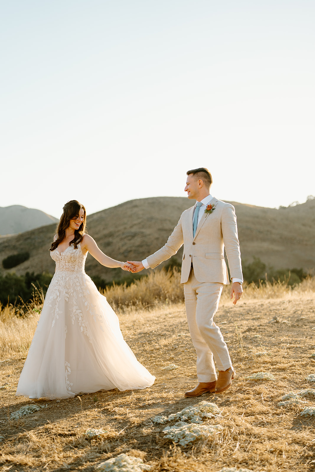 bride and groom dance on hilltop at Higuera Ranch, San Luis Obispo CA, photography by Cobblestone