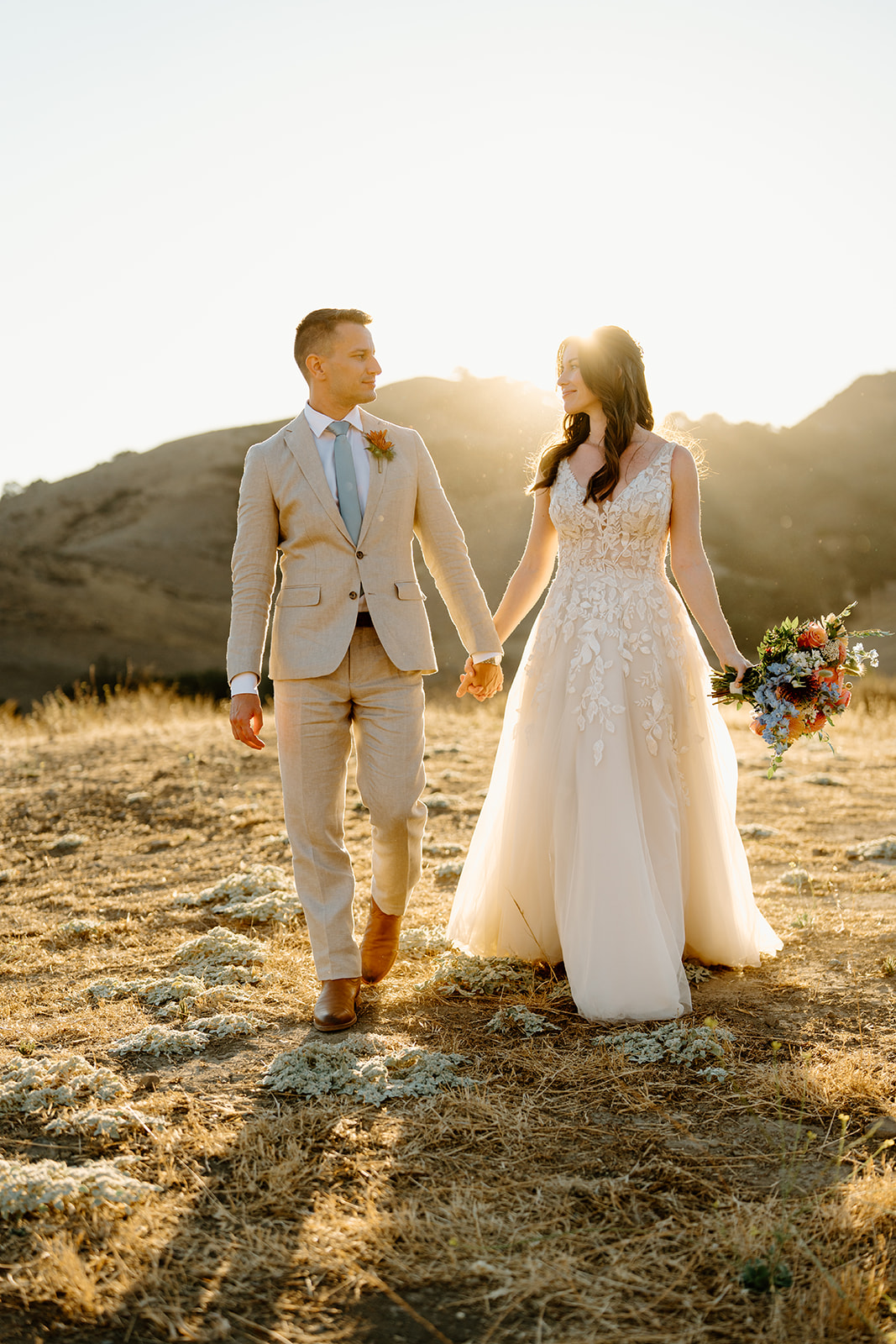 bride and groom walk together at Higuera Ranch, San Luis Obispo CA, photography by Cobblestone