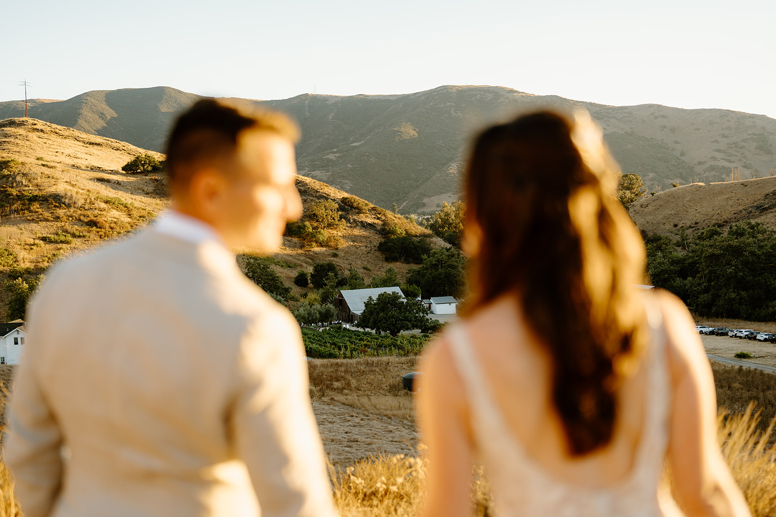 Bride and groom on hill top at Higuera Ranch, San Luis Obispo CA, photography by Cobblestone