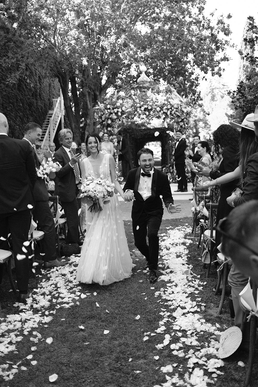 Bride and groom celebrate down the isle after a wedding at the 1880 Union hotel in Los Alamos California