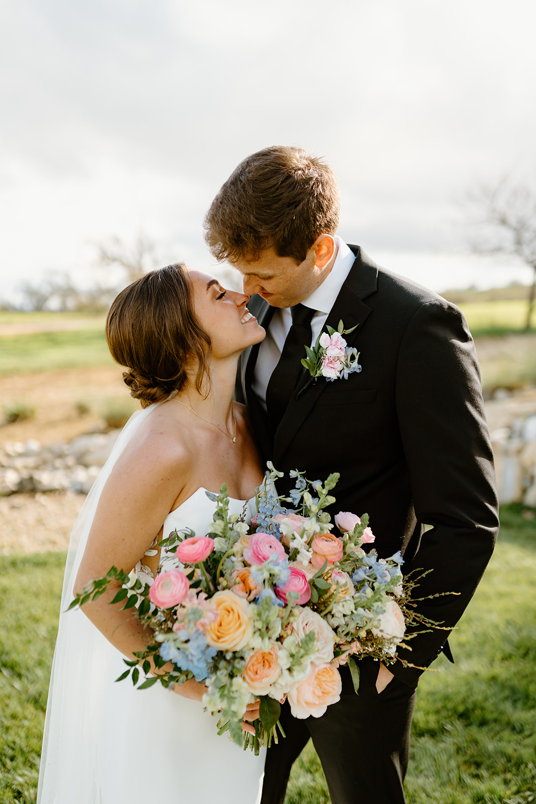 bride and groom snuggled after wedding in San Luis Obispo CA, photography by Cobblestone