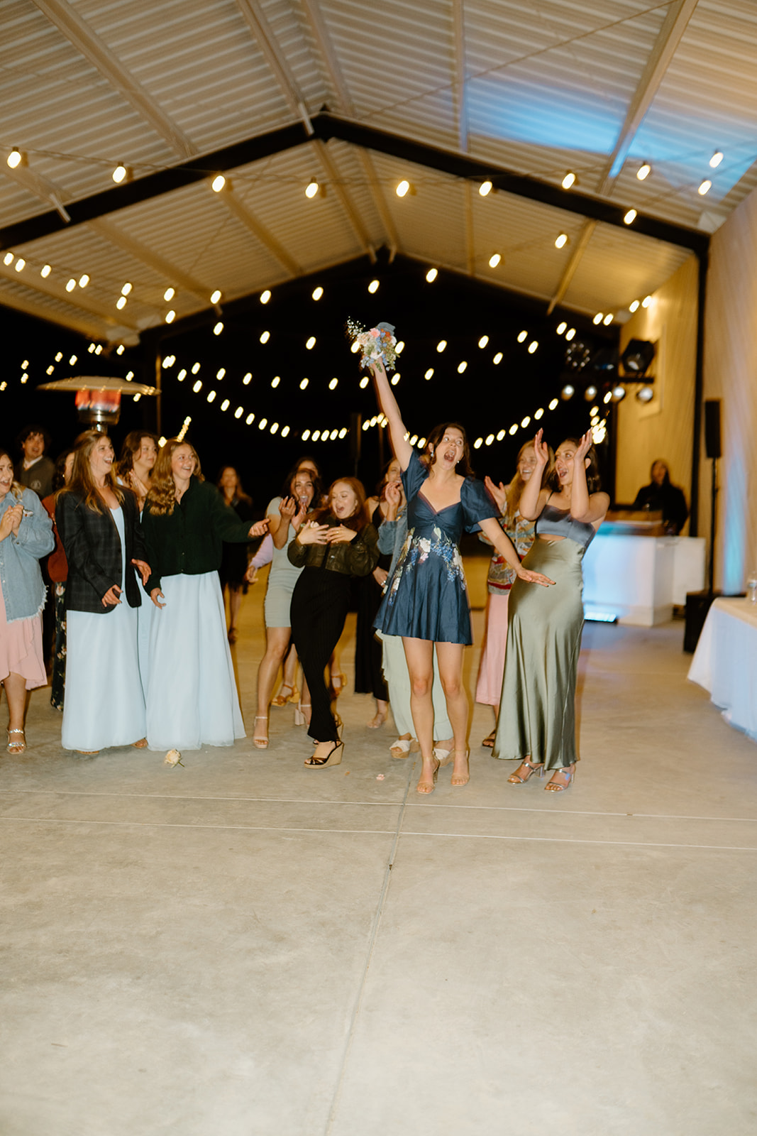 bride throws bouquet in San Luis Obispo CA, photography by Cobblestone