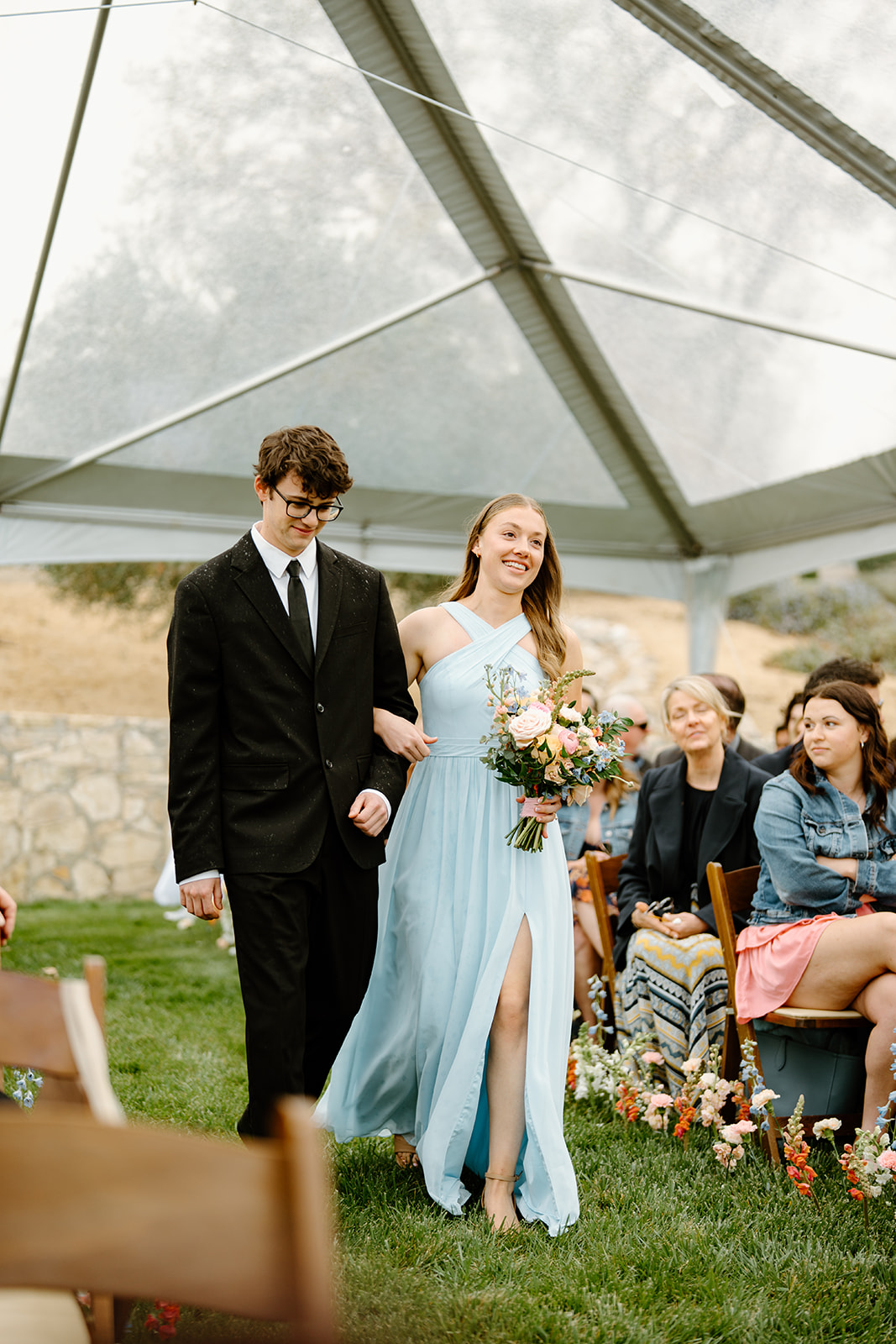 guests walk down isle at wedding in San Luis Obispo CA, photography by Cobblestone