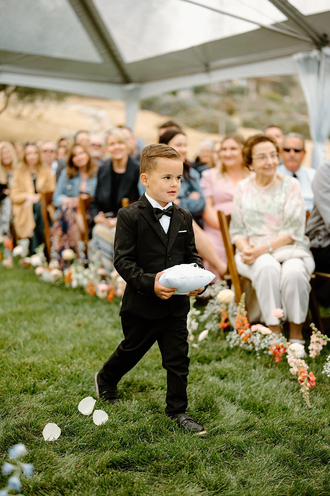 flower girl walks down isle at wedding in San Luis Obispo CA, photography by Cobblestone