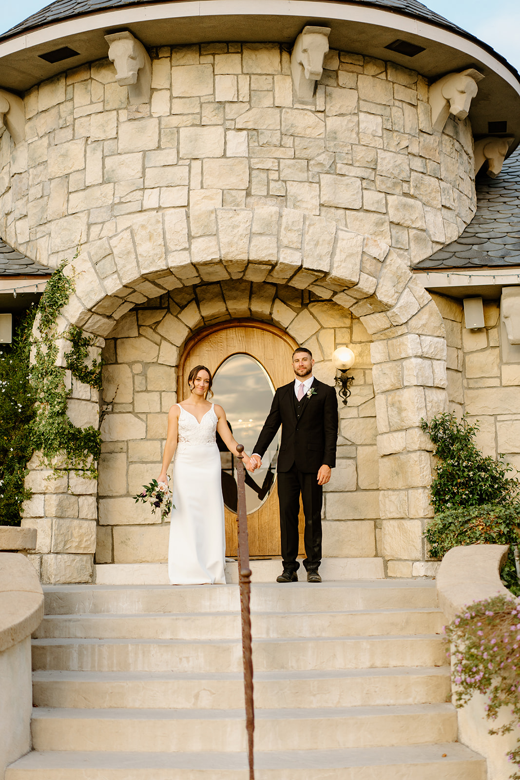 bride and groom walk steps at Chateau Noland in San Luis Obispo CA, photography by Cobblestone
