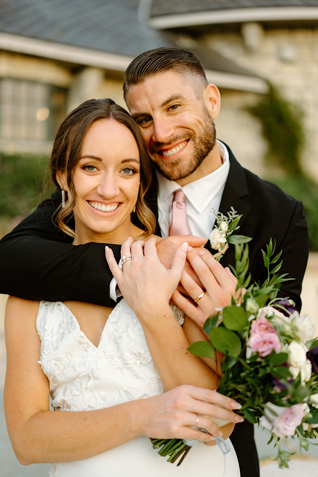 bride and groom hug at Chateau Noland in San Luis Obispo CA, photography by Cobblestone