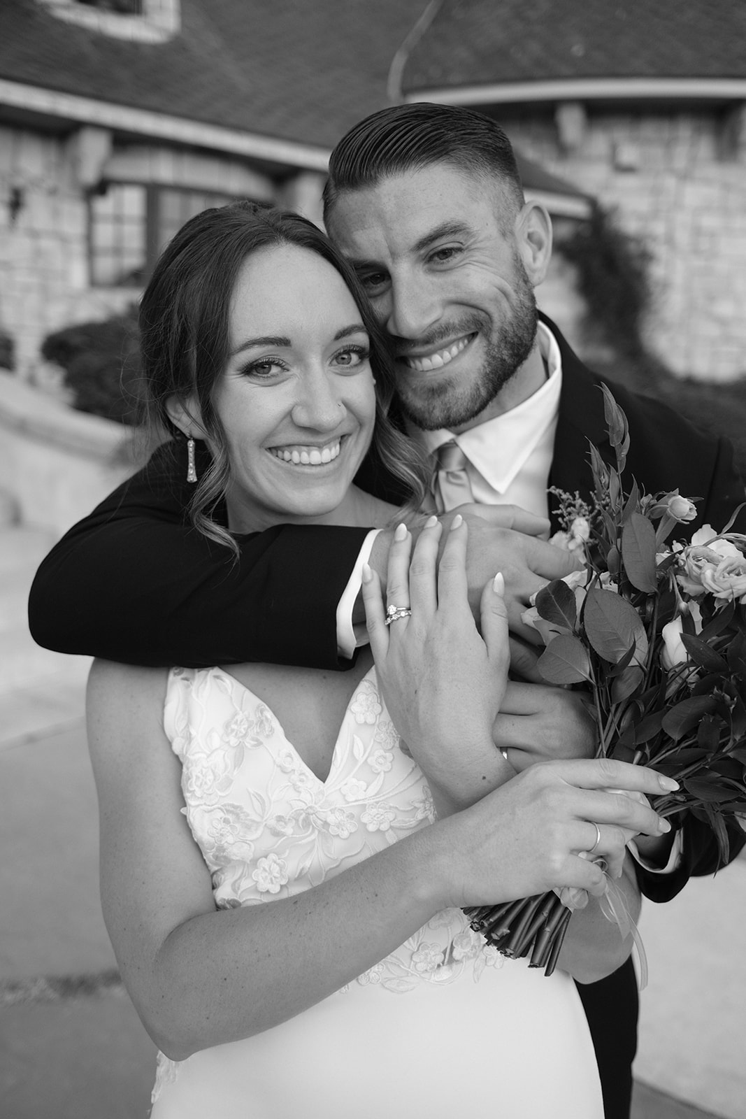 bride and groom hug at Chateau Noland in San Luis Obispo CA, photography by Cobblestone