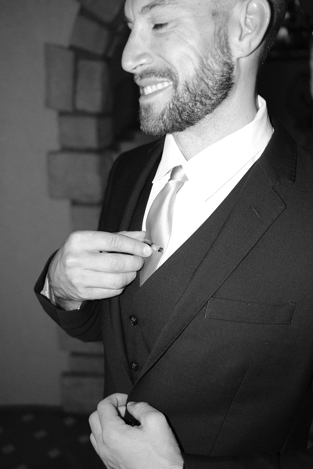 groom details and fixing cuffs at wedding in San Luis Obispo CA, photography by Cobblestone