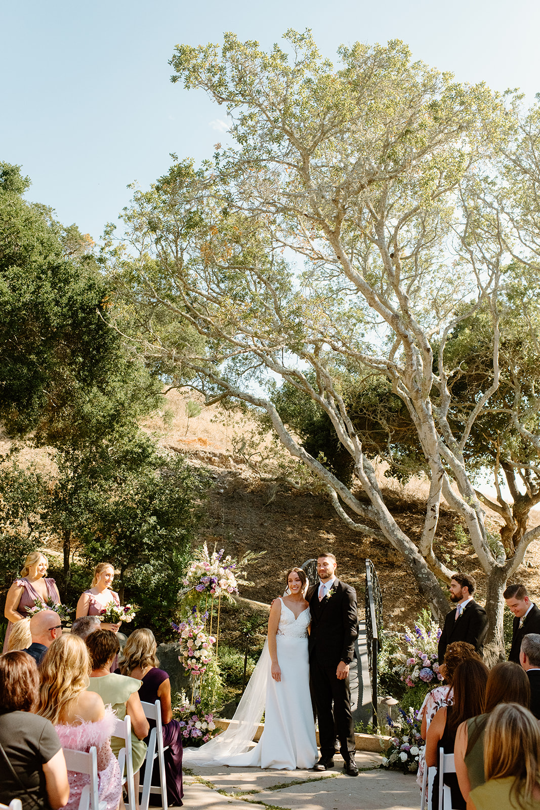 bride walk down isle at wedding in San Luis Obispo CA, photography by Cobblestone