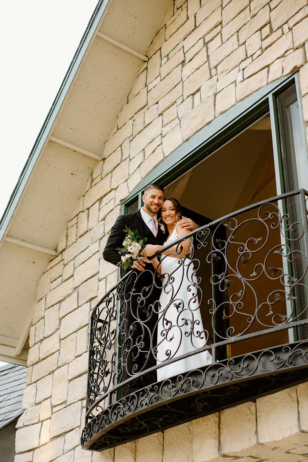 bride and groom on the balcony wedding in San Luis Obispo CA, photography by Cobblestone
