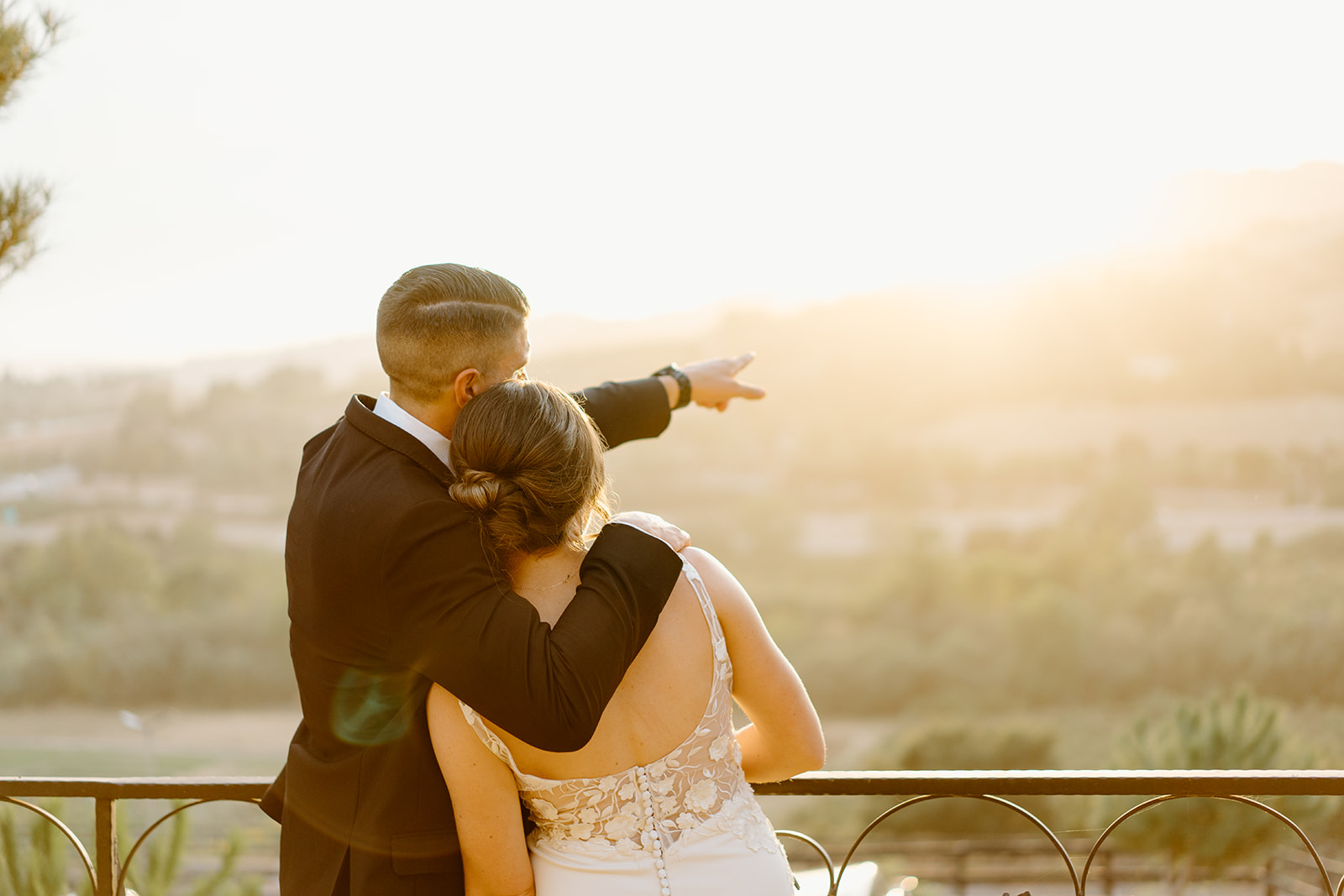 bride and groom on the balcony wedding in San Luis Obispo CA, photography by Cobblestone