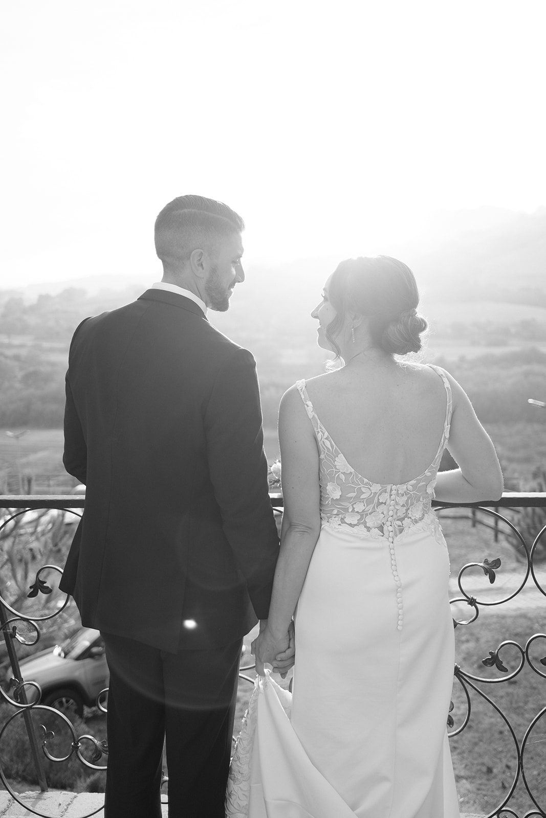 bride and groom on the balcony wedding in San Luis Obispo CA, photography by Cobblestone