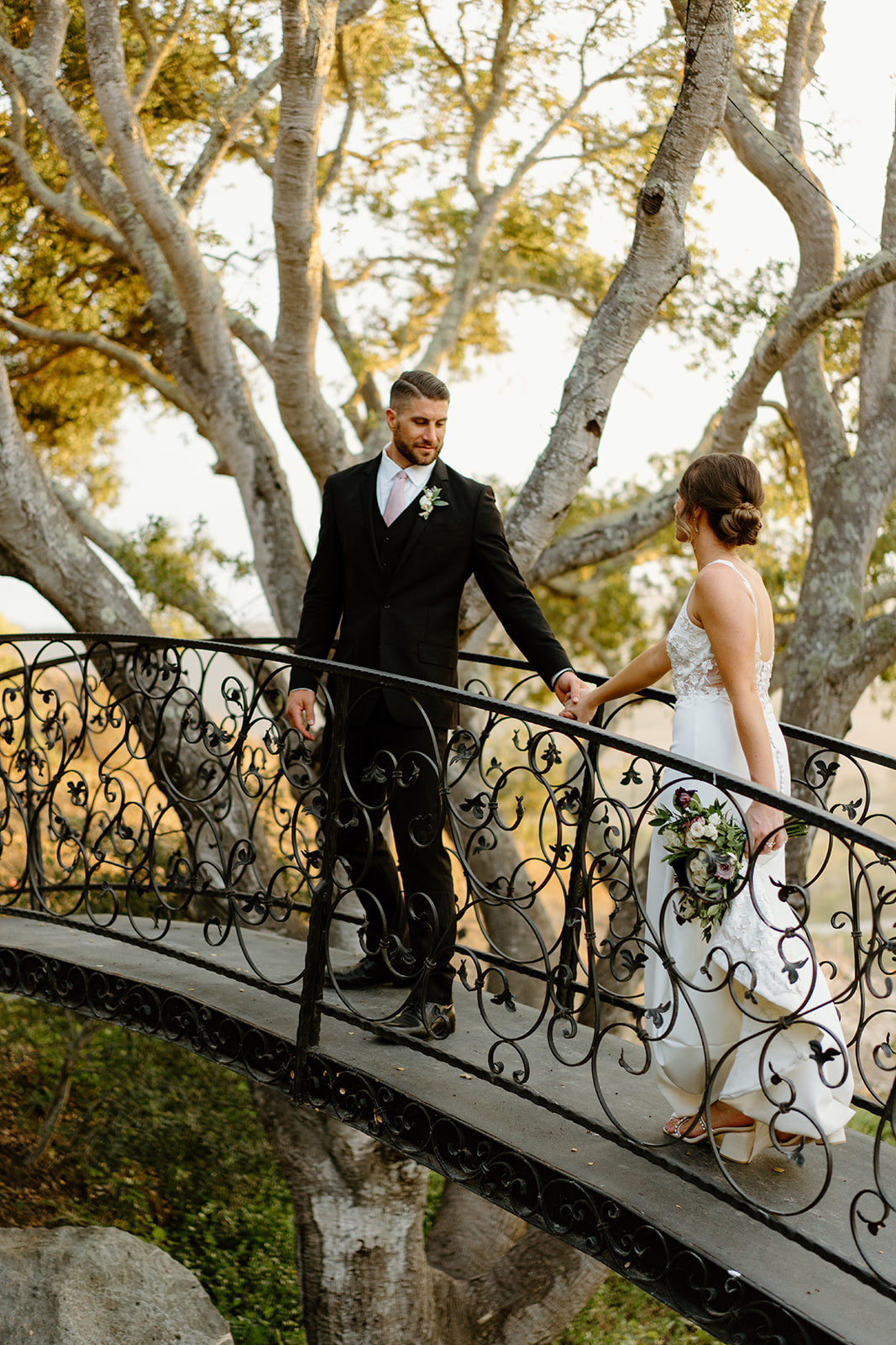 bride and groom pose holding hands after wedding in San Luis Obispo CA, photography by Cobblestone